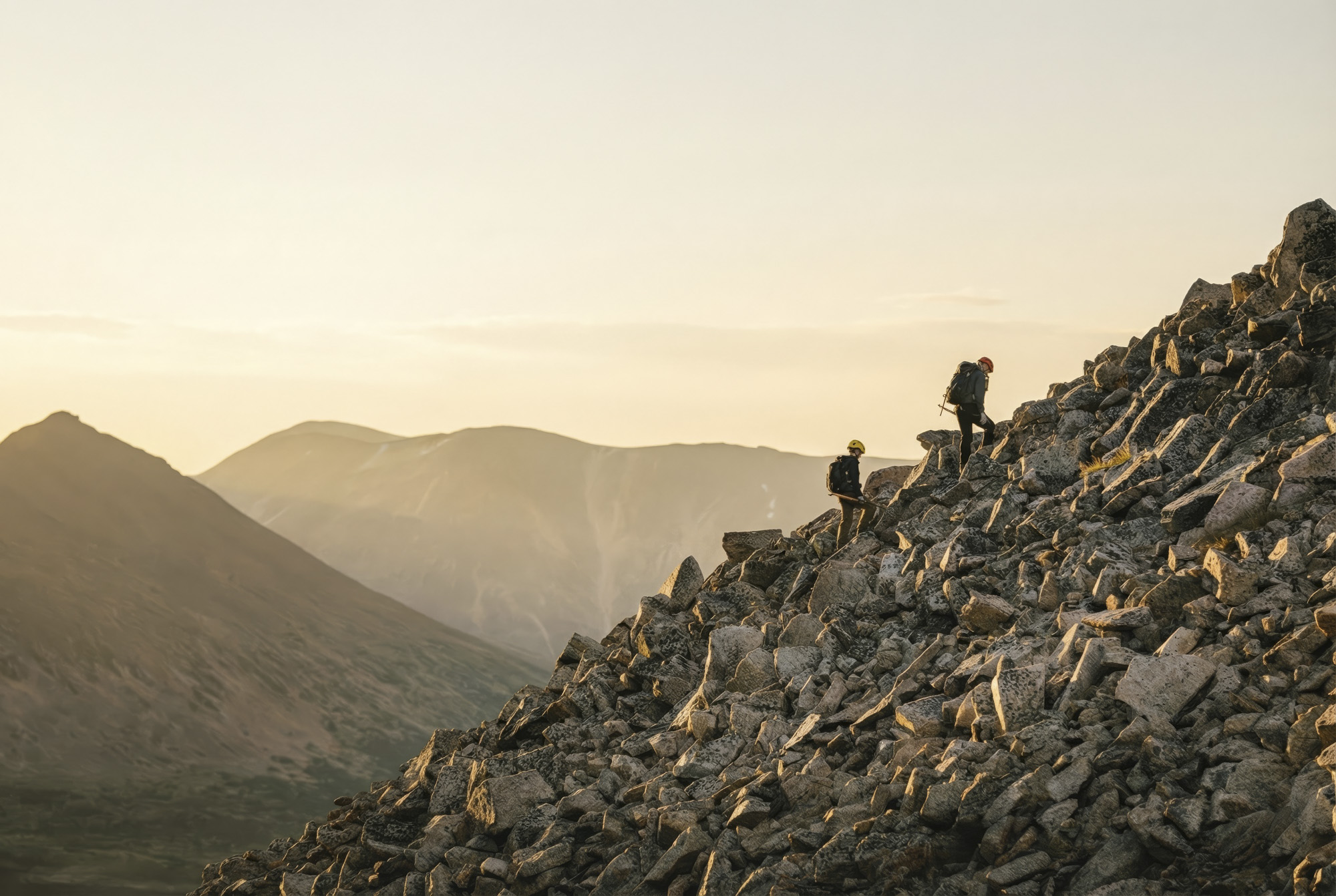 Field team on steep mountain terrain